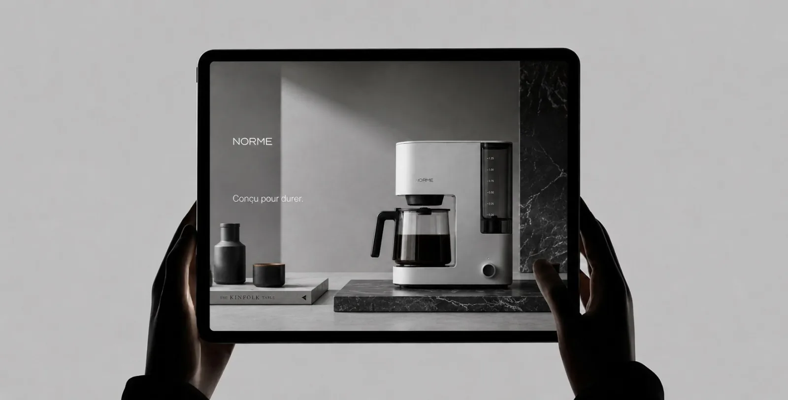 Brochure website for a home appliance brand, on a tablet held in both hands
